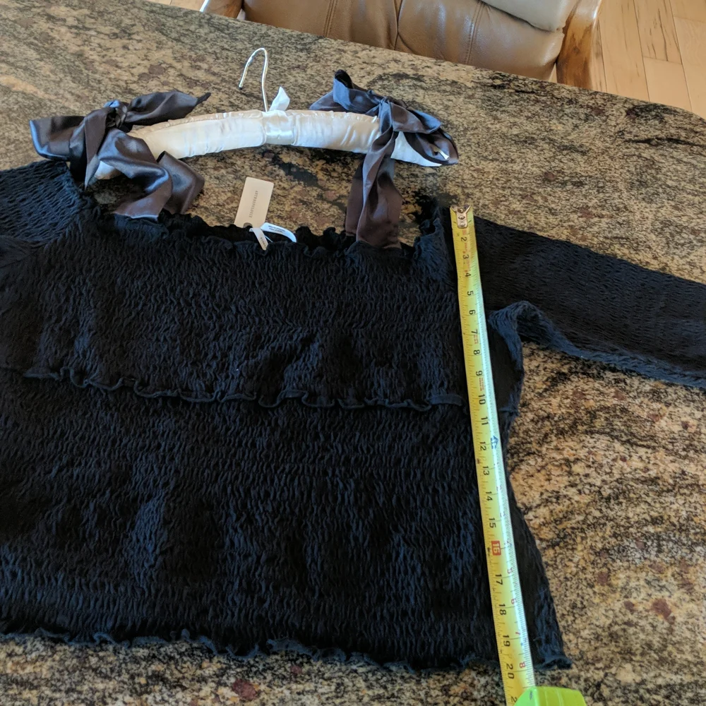 Anthropologie bow off shoulder smocked top black